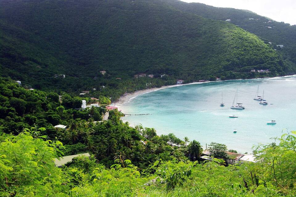 Cane Garden Bay, Tortola, from the hillside: the curve of sand, yachts at anchor and the green north-shore hills