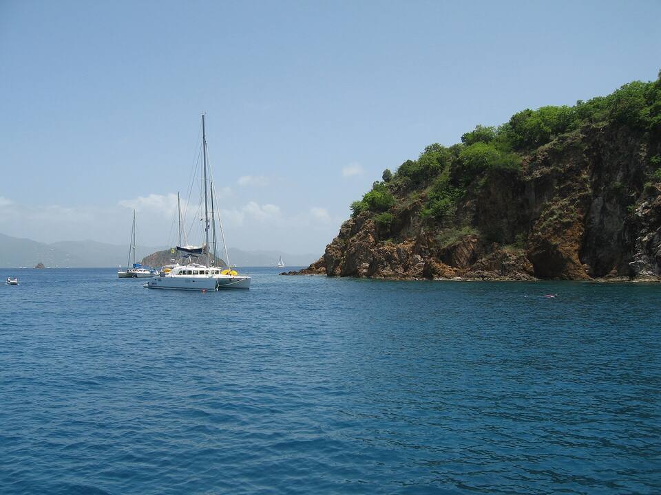 Boats on the day moorings off the cliffs of Treasure Point, Norman Island, where the caves are